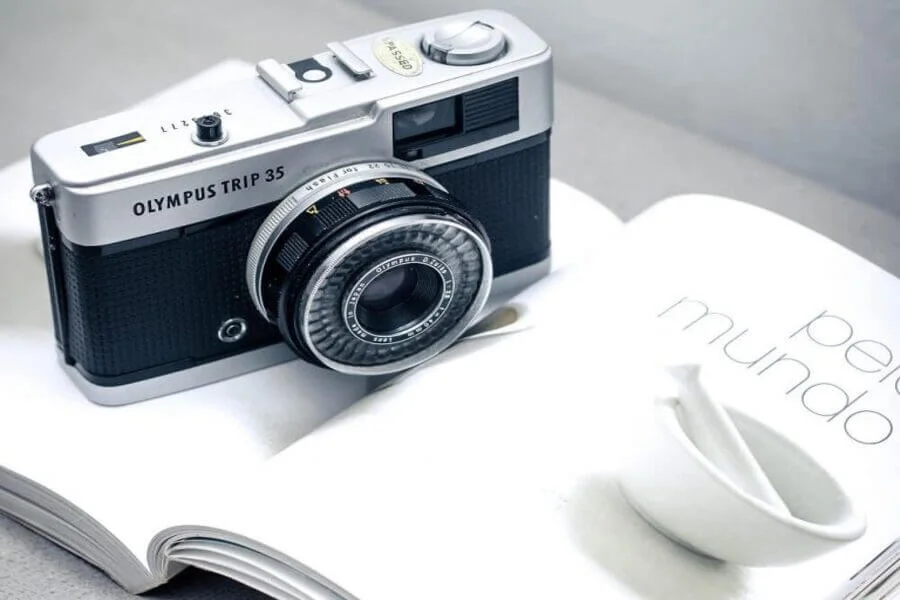 Photographer learning camera settings by understanding camera features and functions