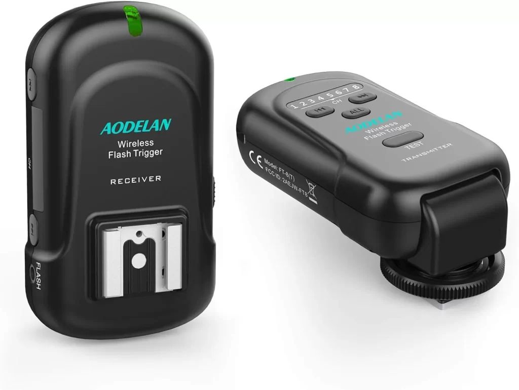 Wireless camera flash trigger device used to remotely control external flashes for professional photography lighting setups
