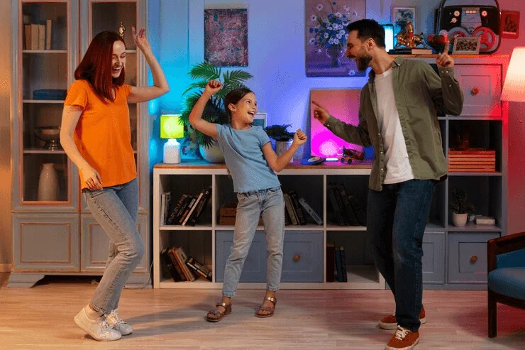 Parents and Kid dancing family photo idea