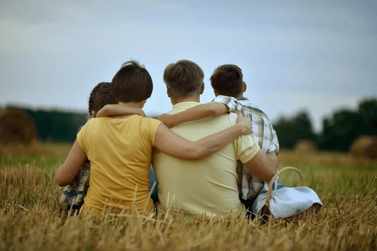 A warm hug from behind between family members