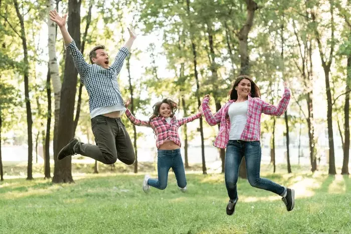 "Jumping Together" family photo pose