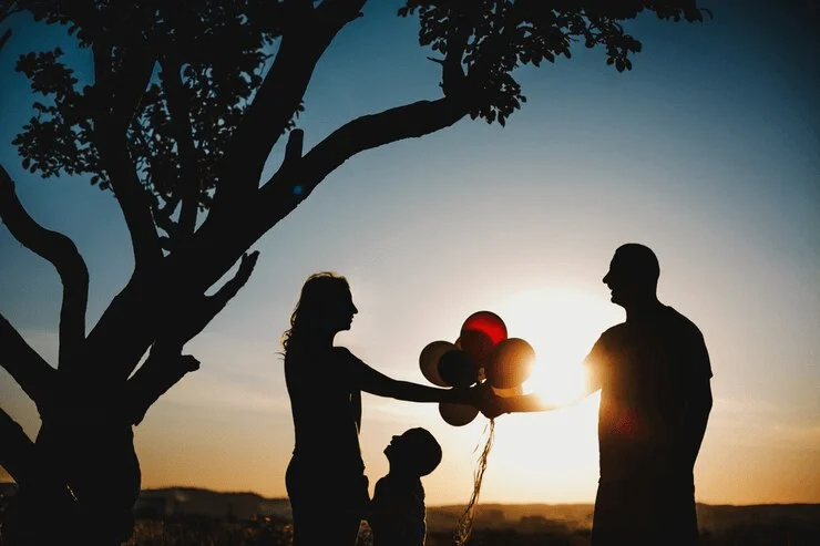 Classic silhouette photo of a family at sunset