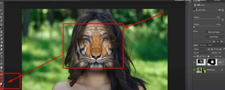 Fine-tuning the tiger face alignment with the model's face in Photoshop.