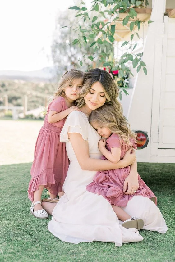 Posing with Two Babies in the Backyard